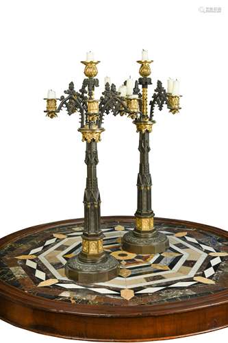 A pair of bronze and gilt bronze Puginesque six light candel...