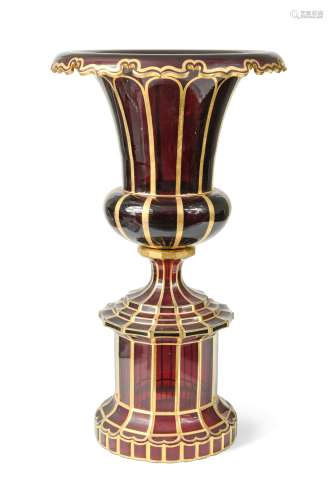 A Bohemian red glass pedestal urn, 19th century,