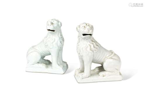 A pair of 18th century Delft white glazed models of lions,