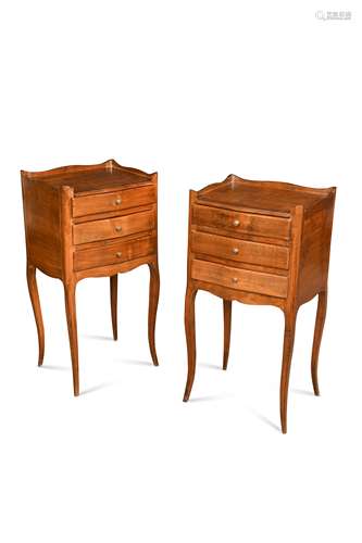 A pair of French provincial fruitwood and chestnut bedside t...