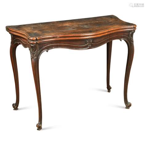 A George III mahogany serpentine fronted fold over card tabl...
