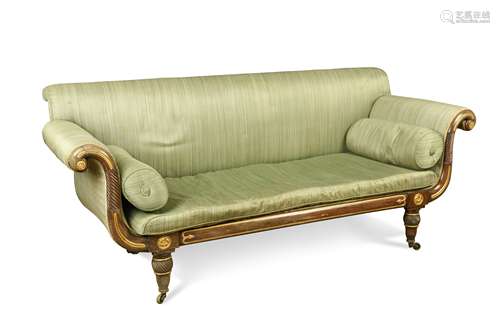 A Regency scroll end settee, upholstered in green figured ho...