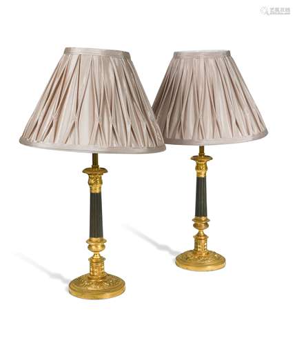 A pair of Regency bronze and gilt bronze candlestick lamps,