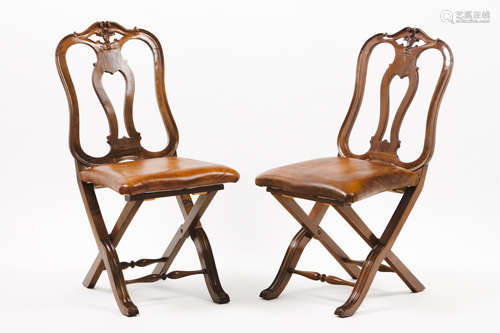 A set of four D.José style folding chairsWalnut Pierced and ...