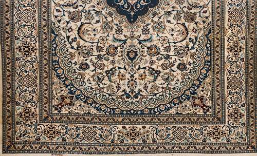 A Nain rugWool and cotton Blue and beige shades of floral pa...