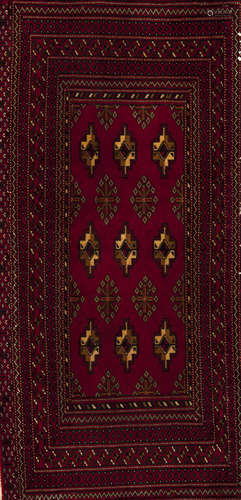 A Turkmen rug, IranWool and cotton Geometric pattern in bord...