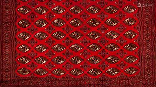 A Bukhara rug, IranWool and cotton Geometric pattern in red,...