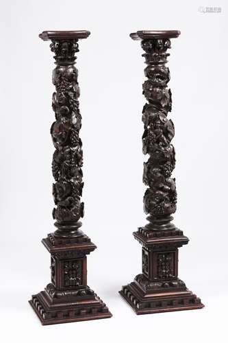 A pair of columnsCarved wood Square stand of raised foliage ...