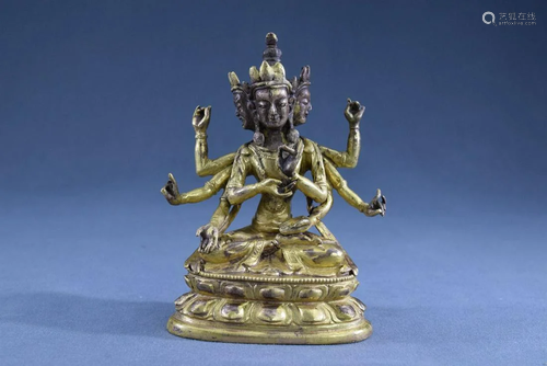 A Gilt Bronze Three Heads and Eight Arms Buddha Figure