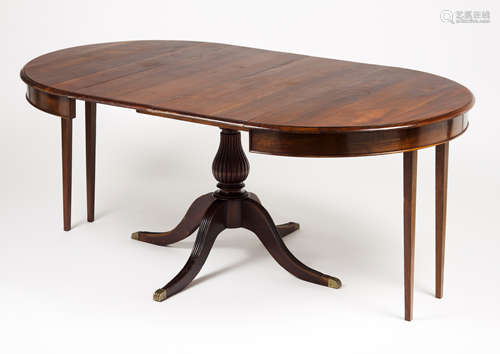 A dinning tableMahogany Extensible top, with central column ...