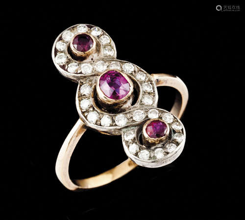 A ringGold and silver Set with 3 round cut rubies and 30 bri...