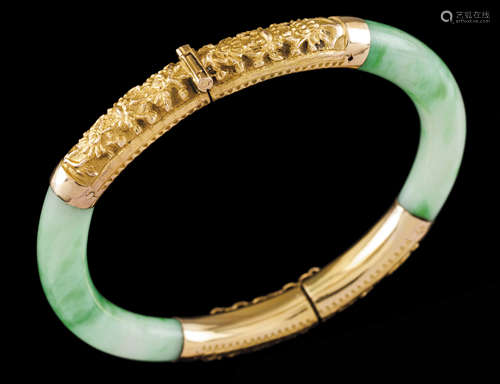 A braceletGold and jade Hinged jade elements of applied gold...