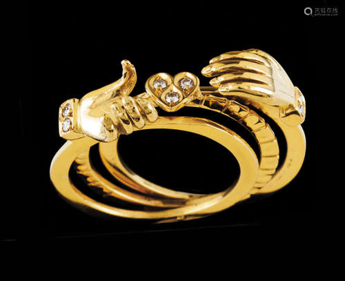 A commitment ringPortuguese gold hands Two hands holding hea...