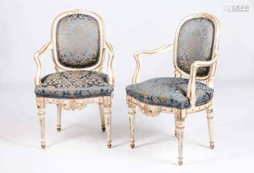 A pair of fauteuilsLacquered and silvered timber Carved foli...