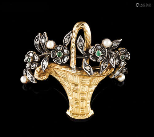 A broochGold and silver Flower basket set with small emerald...