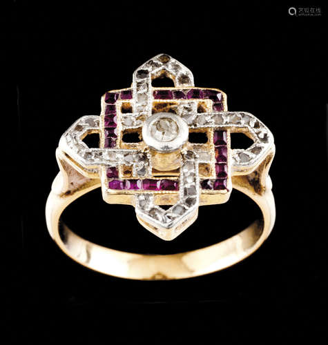 An Art deco ringSilver and gold Set with calibrated rubies a...