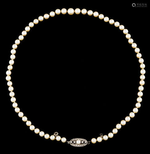 A cultured pearl necklaceGold clasp Oval shaped set with one...