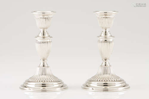 A pair of candle standsPortuguese silver Neoclassical fluted...