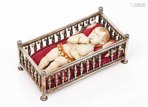 A reclining Baby JesusIndo-Portuguese ivory sculpture Gold a...