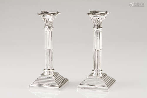 A pair of candle standsPortuguese silver Doric column shaped...