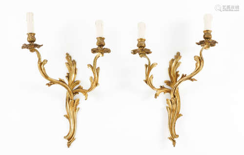 A set of four Louis XV style two branch wall sconcesGilt bro...