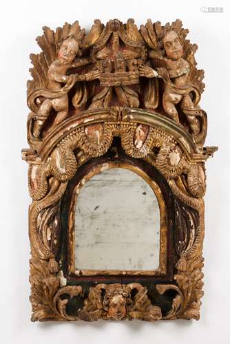 An altar fragmentCarved, gilt and polychrome wood Foliage sc...