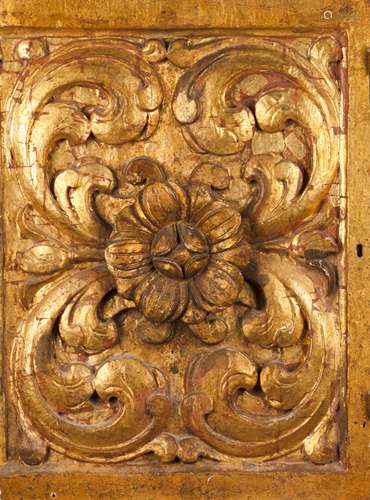 A carved wooden fragmentCarved and gilt wood of foliage moti...