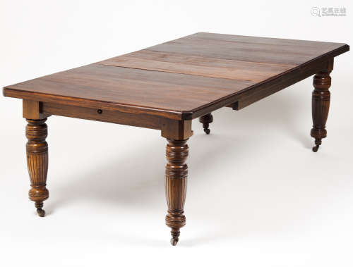 A dining tableMahogany Turned legs of carved decoration Two ...