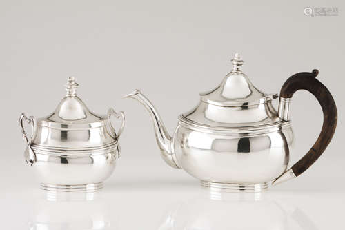 A teapot and sugar bowlPortuguese silver Oval shaped body of...