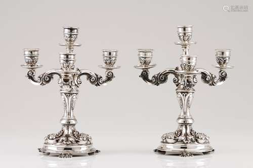 A pair of four branch candelabraPortuguese silver Profuse wi...