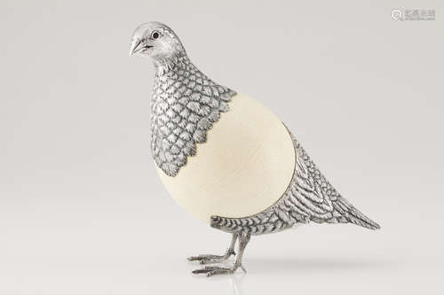 A partridgeSilver and ostrich egg Moulded, engraved and chis...