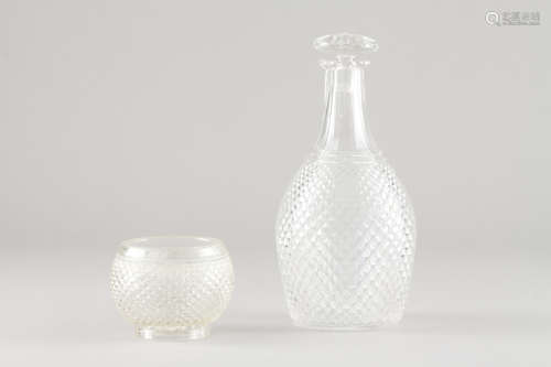 A bottle and beakerMoulded crystal Height: 24 cm (bottle) He...