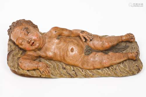 A reclining Child JesusTerracotta sculpture Polychrome decor...