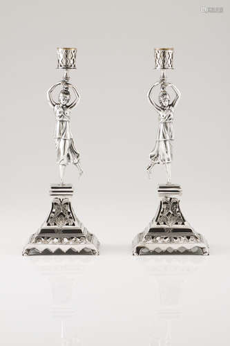 A pair of candle standsPortuguese silver, 19th century Femal...