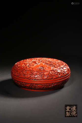 A Cinnabar Lacquer Peony And Stone Hand Box And Cover
