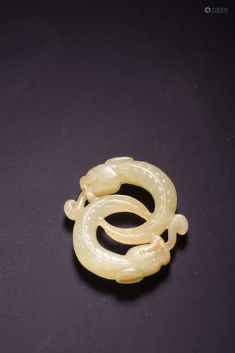 A Carved White Jade Dragon Pendant