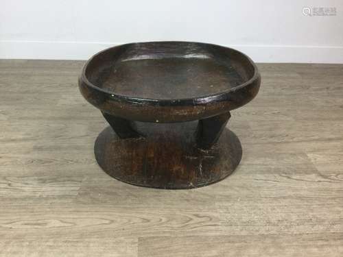 AN AFRICAN CARVED WOOD TABLE