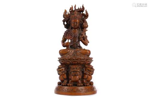 A 20TH CENTURY CHINESE WOOD CARVING OF A DEITY