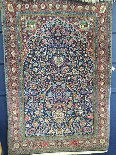 A KASHAN BORDERED PRAYER RUG