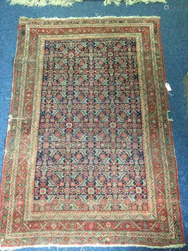 A HAMADAN BORDERED RUG