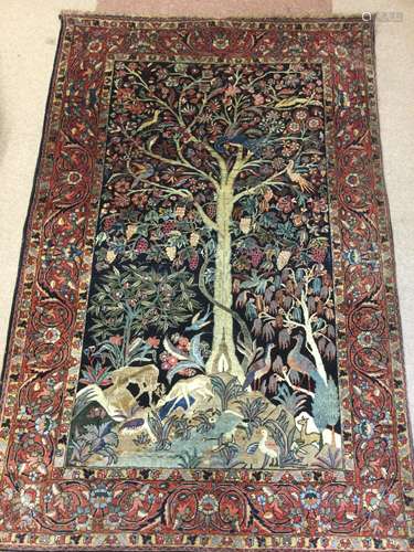 A KIRMAN TREE OF LIFE BORDERED RUG