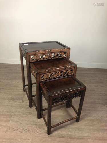 A 20TH CENTURY CHINESE HARDWOOD NEST OF THREE TABLES