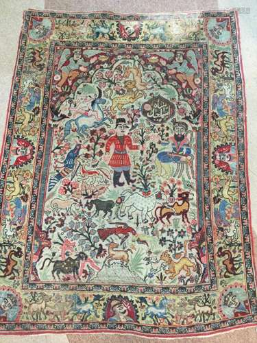 A HUNTING KIRMAN BORDERED PRAYER RUG