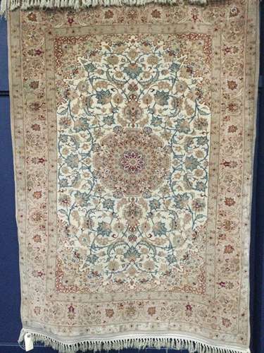 A SMALL BORDERED RUG OF KASHAN DESIGN