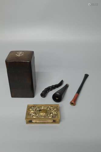 A EBONY CIGARETTE BOX AND THREE CIGARETTE HOLDER ,A BRASS VE...