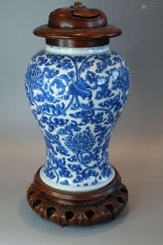 A CHINESE BLUE AND WHITE VASE WITH HARDWOOD STAND AND COVER ...