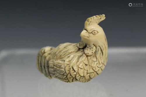 Japanese carving of a chicken.