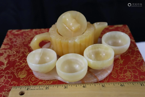 A set of Chinese carved jade teapot and teacups.