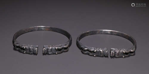 PAIR OF SILVER CAST BANGLES