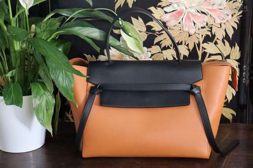 CELINE. Sac en cuir orange et noir.